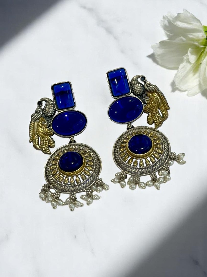 GERMAN SILVER DUAL TONE BLUE STONE PEACOCK DANGLE EARRINGS