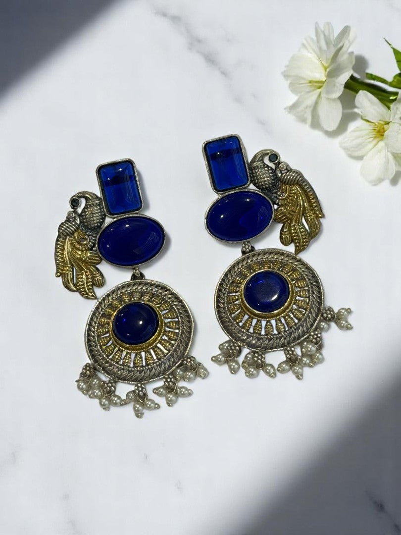 GERMAN SILVER DUAL TONE BLUE STONE PEACOCK DANGLE EARRINGS