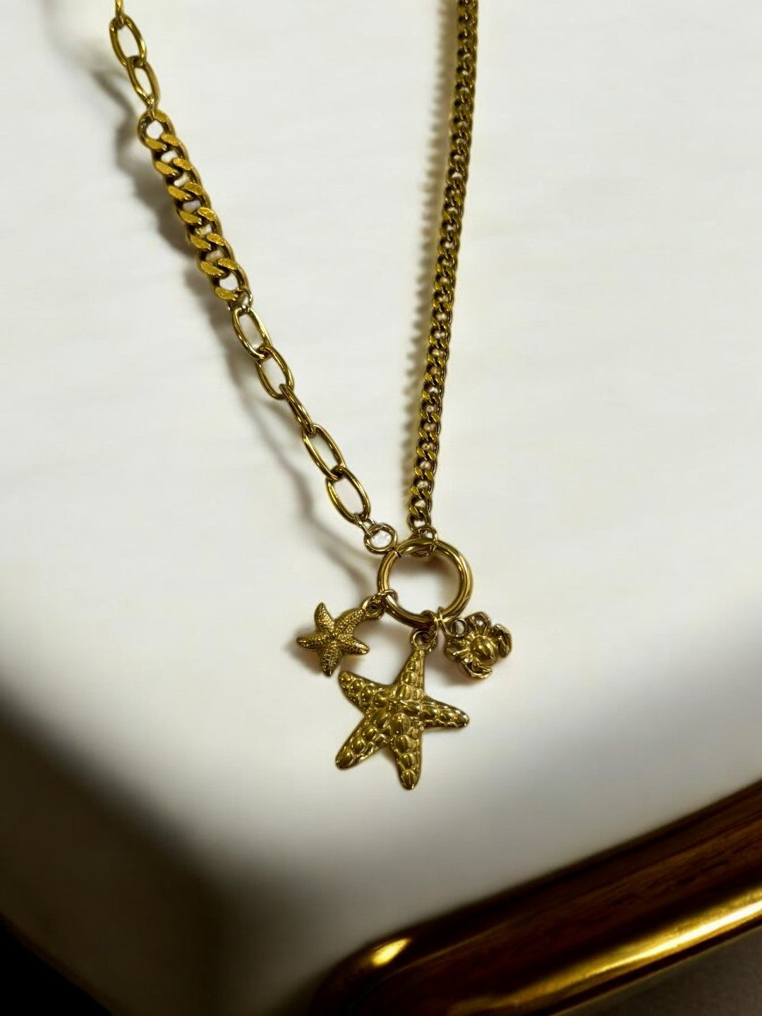 GOLDEN CHAIN WITH BEACH CHARM LIKE STAR FISH AND CRAB