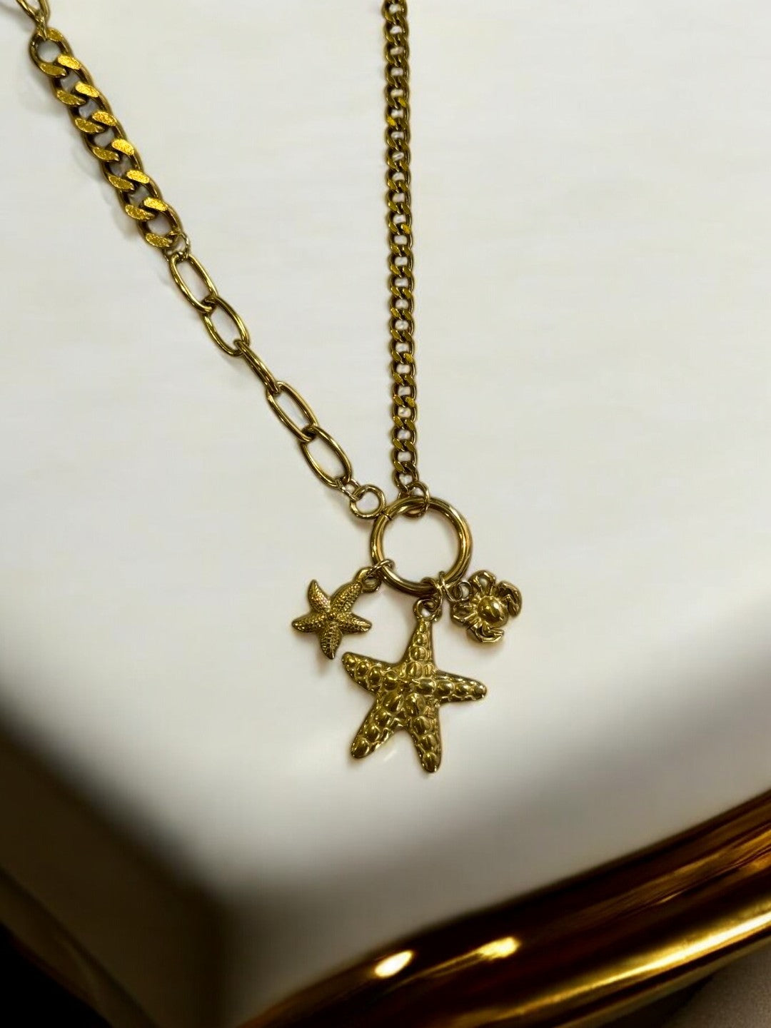 GOLDEN CHAIN WITH BEACH CHARM LIKE STAR FISH AND CRAB