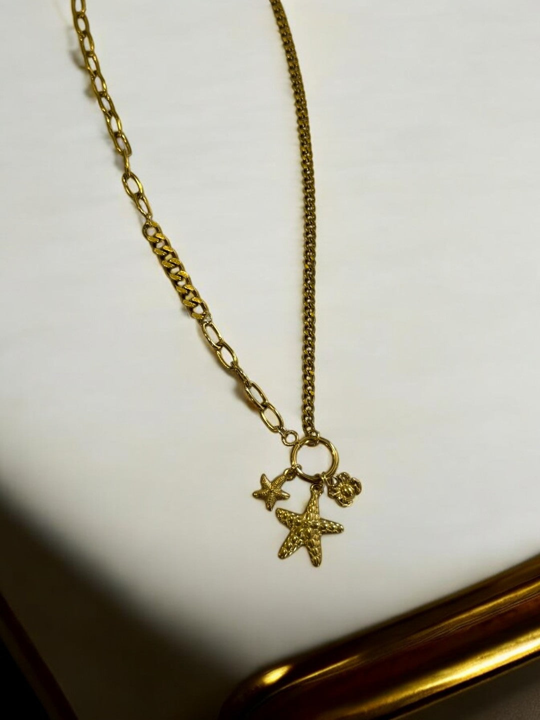 GOLDEN CHAIN WITH BEACH CHARM LIKE STAR FISH AND CRAB