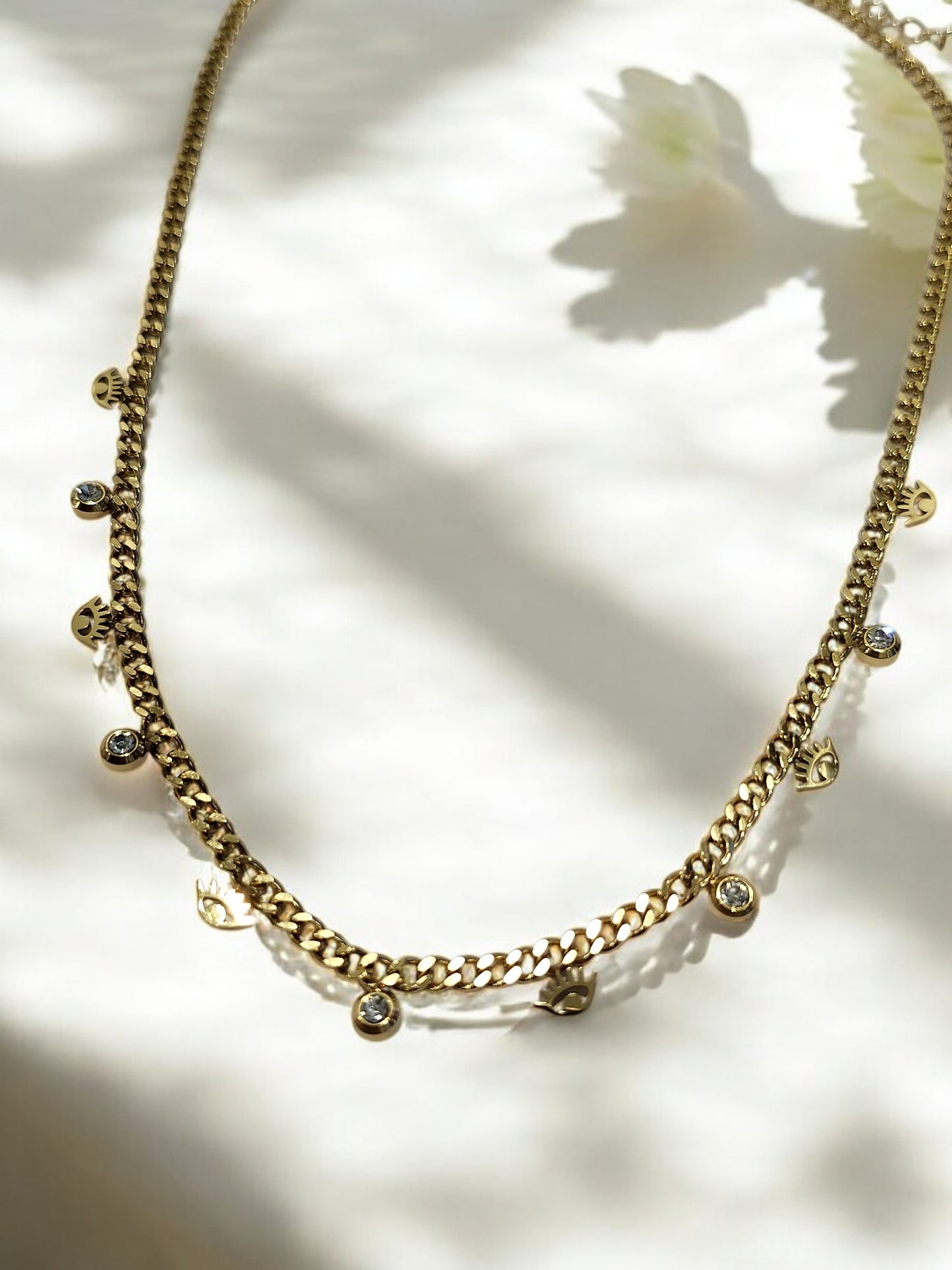 GOLDEN CHAIN WITH SHINY TINY HANGING DIAMOND AND EVIL EYE