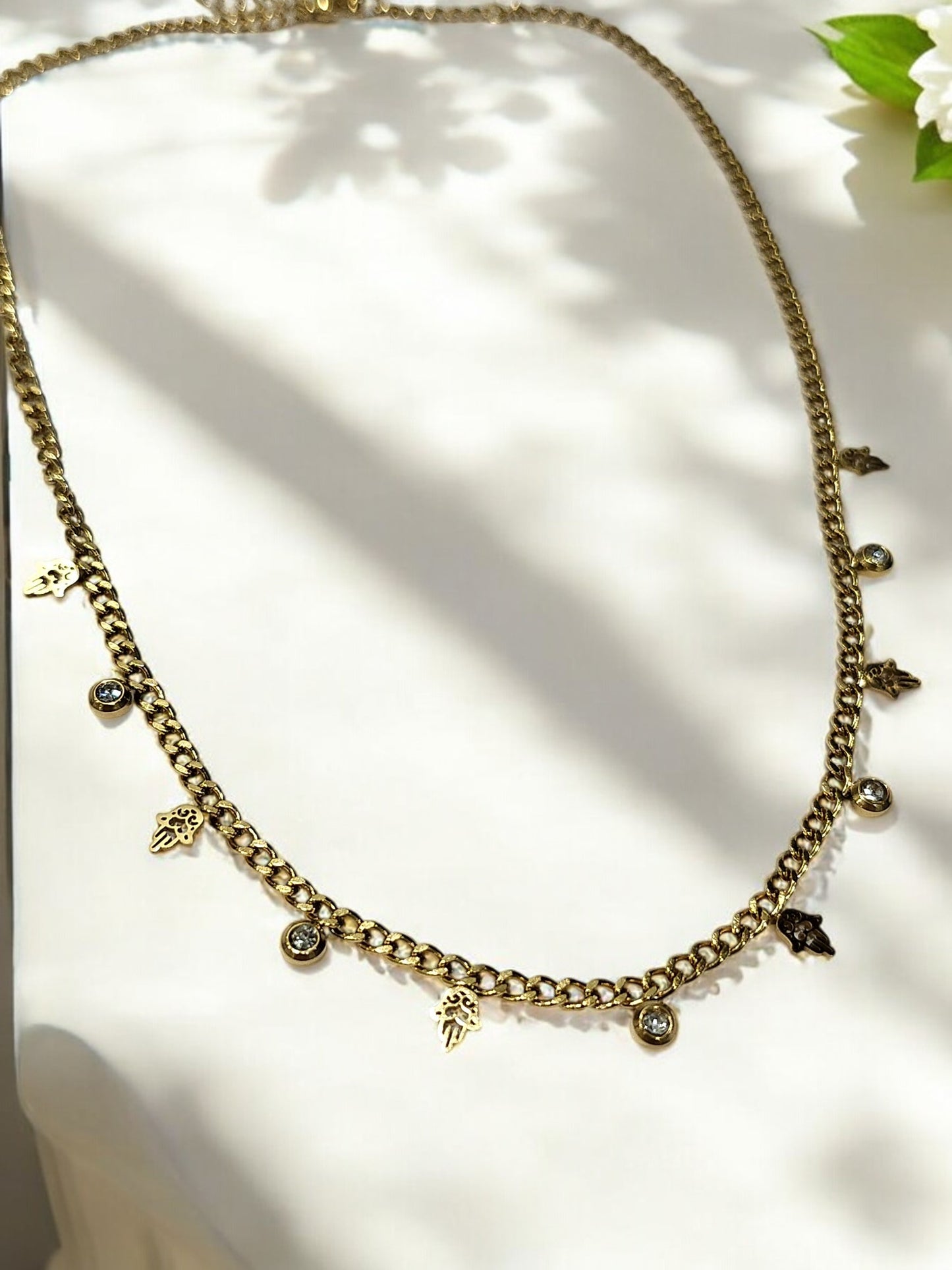 GOLDEN CHAIN WITH HANGING NONVIOLENCE SYMBOL AND HANGING DIAMOND