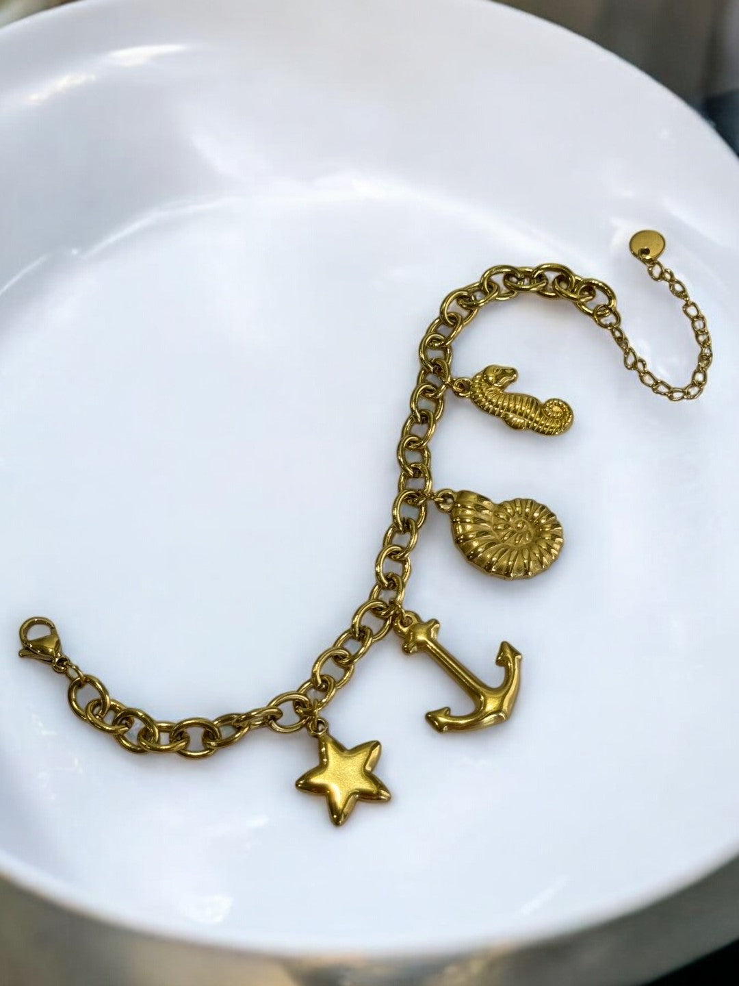 GOLDEN CHAIN BRACELET WITH CHARMS LIKE ANCHOR, STAR, SNAIL AND SEASHORE
