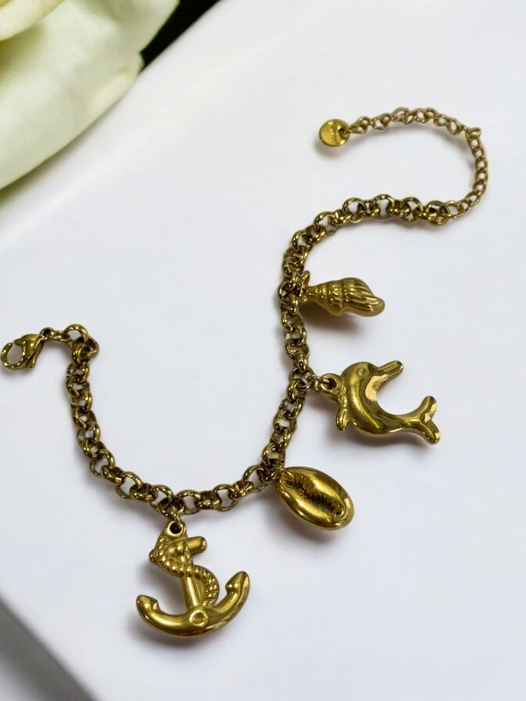 GOLDEN CHAIN BRACELET WITH CHARM LIKE ANCHOR, EYE CONCH AND DOLPHIN