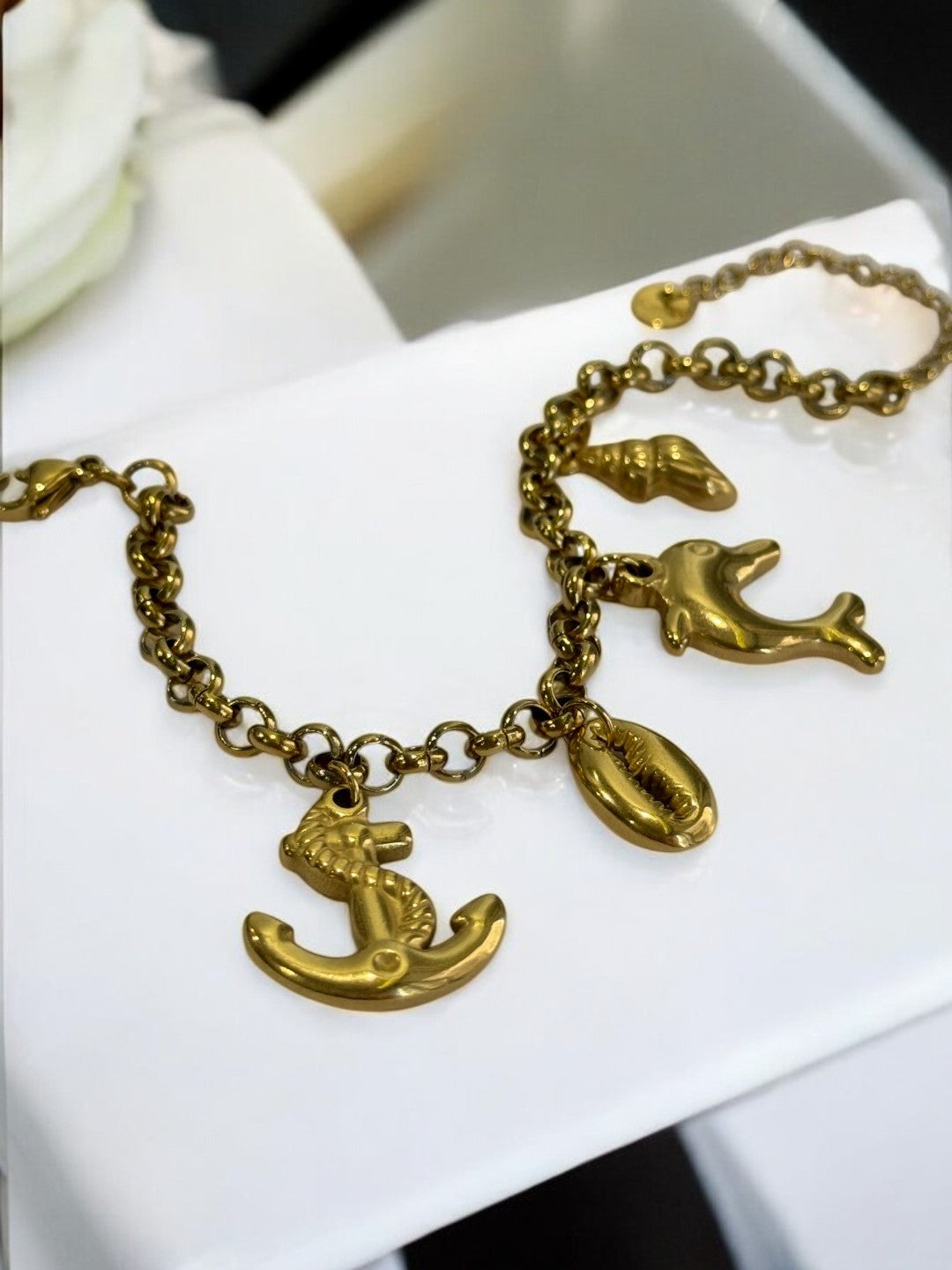 GOLDEN CHAIN BRACELET WITH CHARM LIKE ANCHOR, EYE CONCH AND DOLPHIN