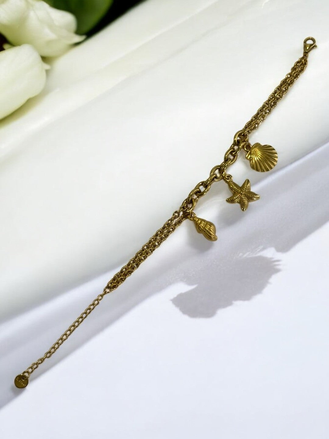 GOLDEN CHAIN BRACELET WITH CONCH, STARFISH, SEA SHELL
