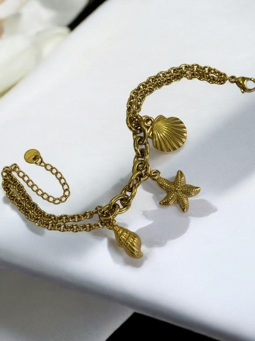 GOLDEN CHAIN BRACELET WITH CONCH, STARFISH, SEA SHELL