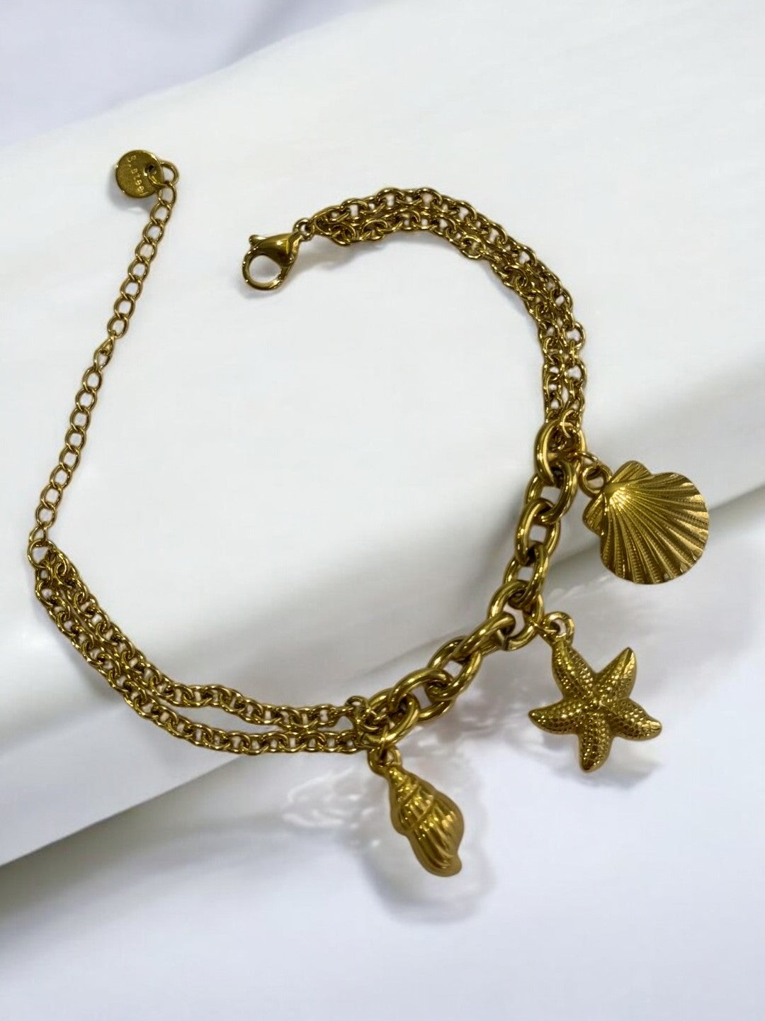 GOLDEN CHAIN BRACELET WITH CONCH, STARFISH, SEA SHELL