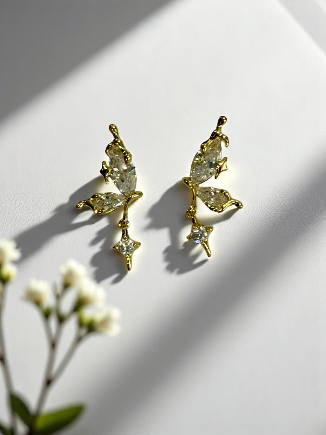 GOLDEN HANGING DIAMOND BUTTERFLY AXEL EARRINGS