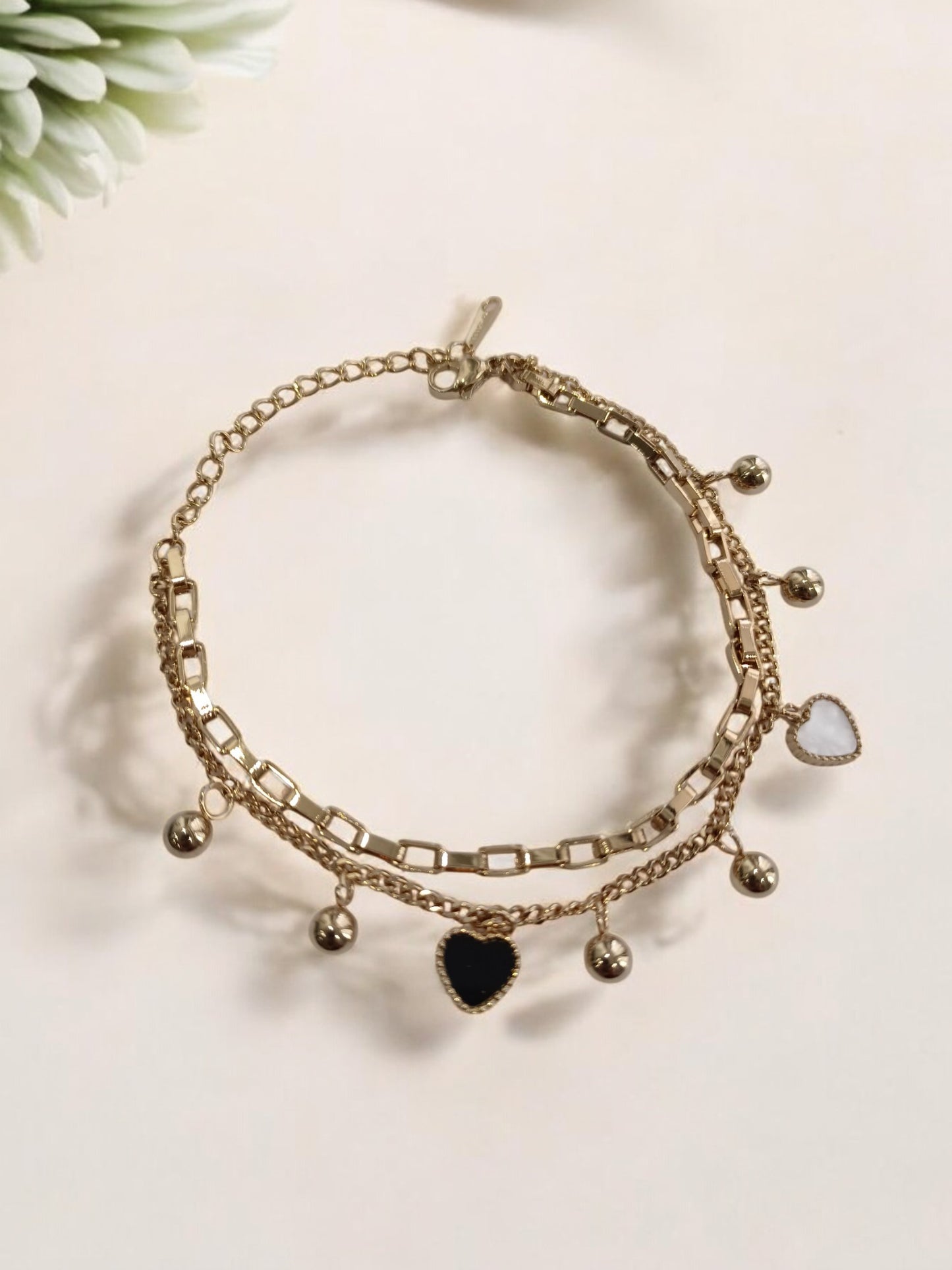 GOLDEN CHAIN WITH BLACK AND WHITE HEART AND PEARLS