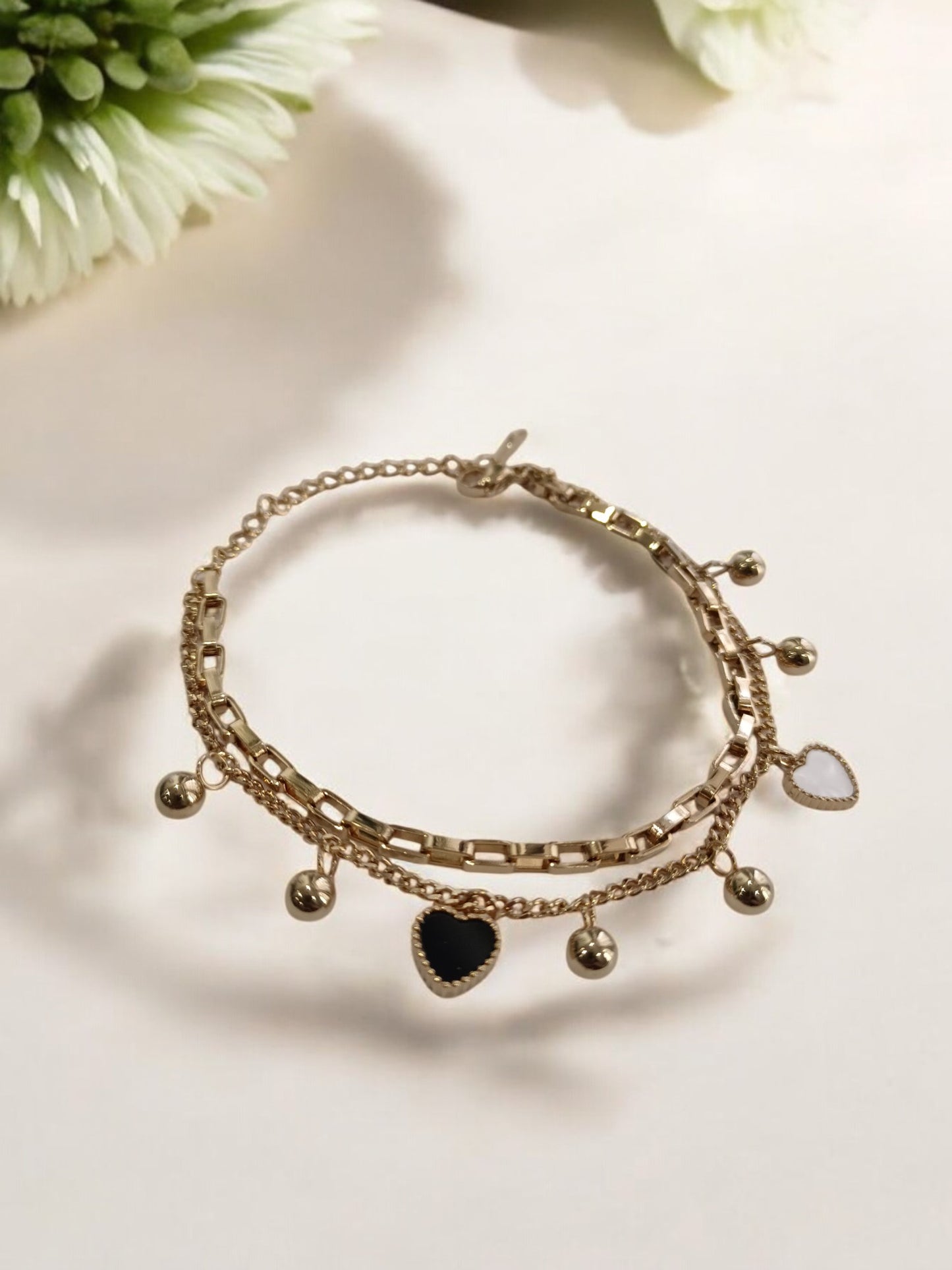 GOLDEN CHAIN WITH BLACK AND WHITE HEART AND PEARLS