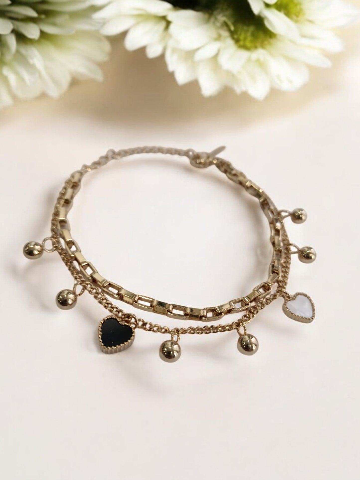 GOLDEN CHAIN WITH BLACK AND WHITE HEART AND PEARLS