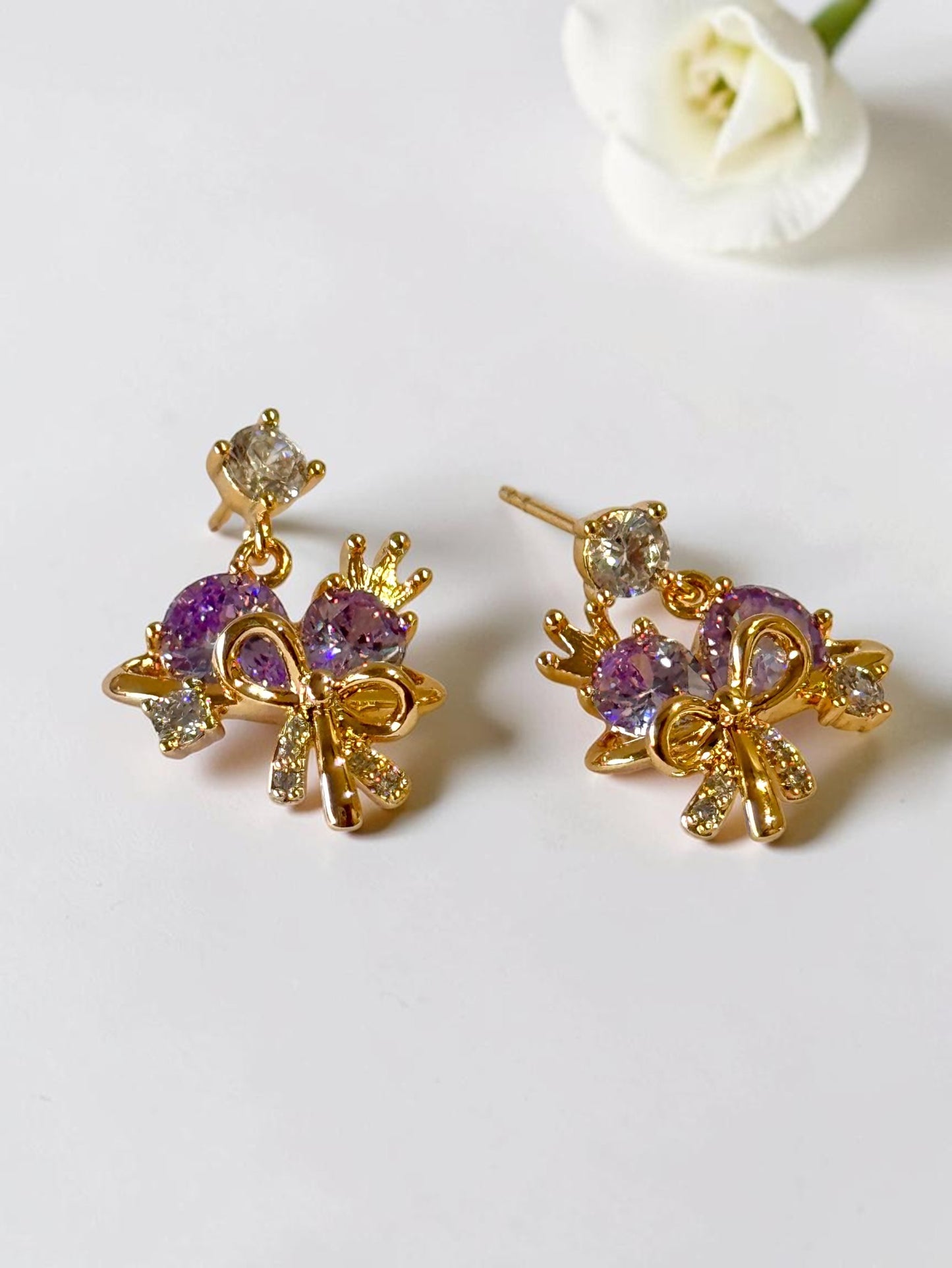 PURPLE STONE BOW AARA EARRINGS