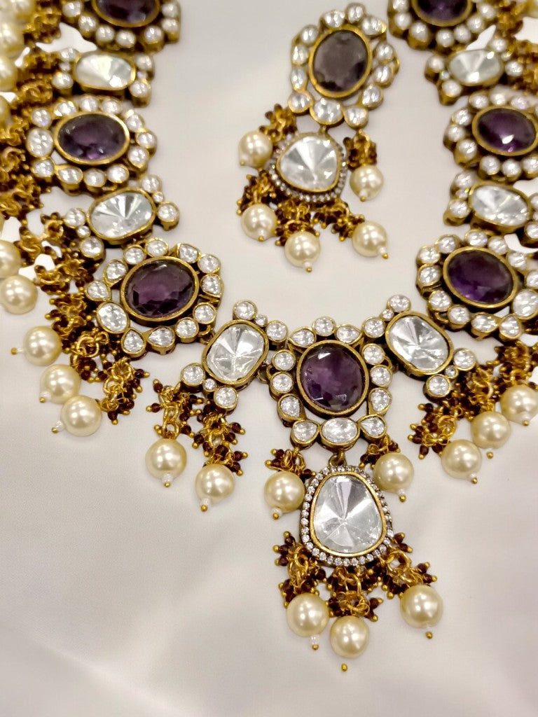 PURPLE STONE AND KUNDAN NECKLACE WITH HANGING PEARLS AND DANGLING EARRING