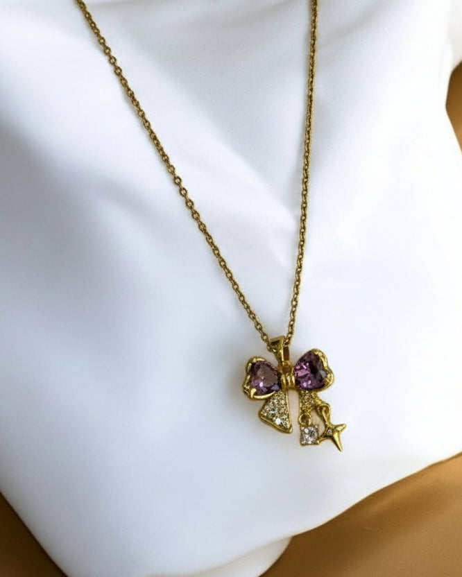 GOLDEN CHAIN WITH PURPLE DIAMOND BOW AND STAR