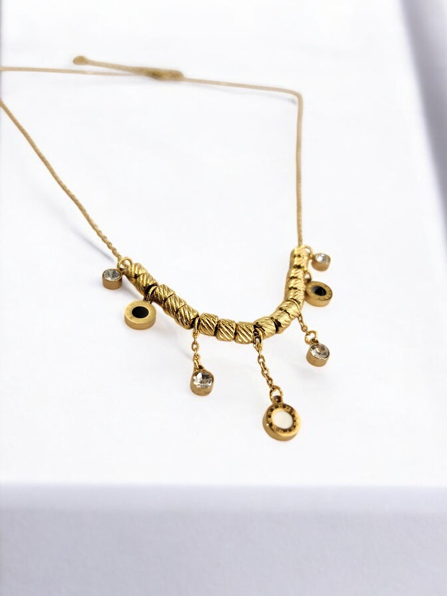 GOLDEN CHAIN WITH HANGINIG DIAMOND AND ROMAN NUMERAL CHARM