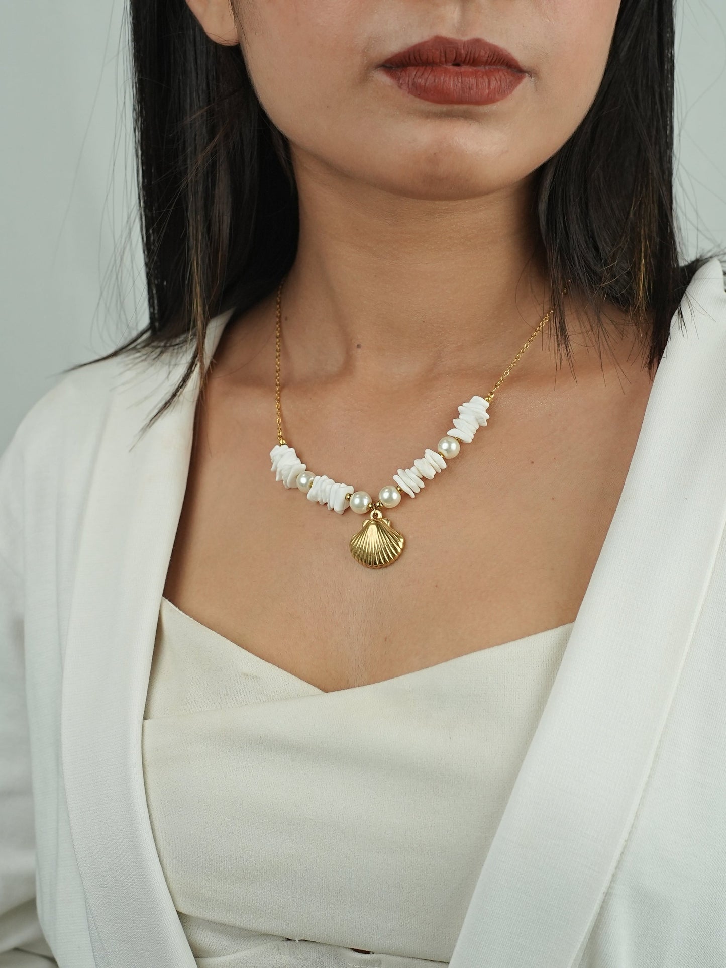 GOLDEN CHAIN WITH BEAUTIFUL PEARLS AND SHE SHELL