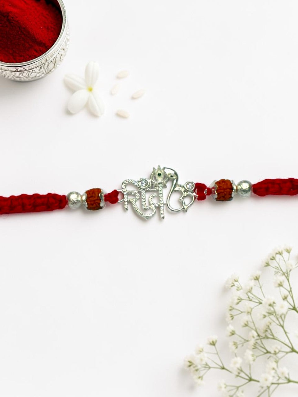 DIAMOND SHIV CHARMS FALGUNI SILVER RAKHI