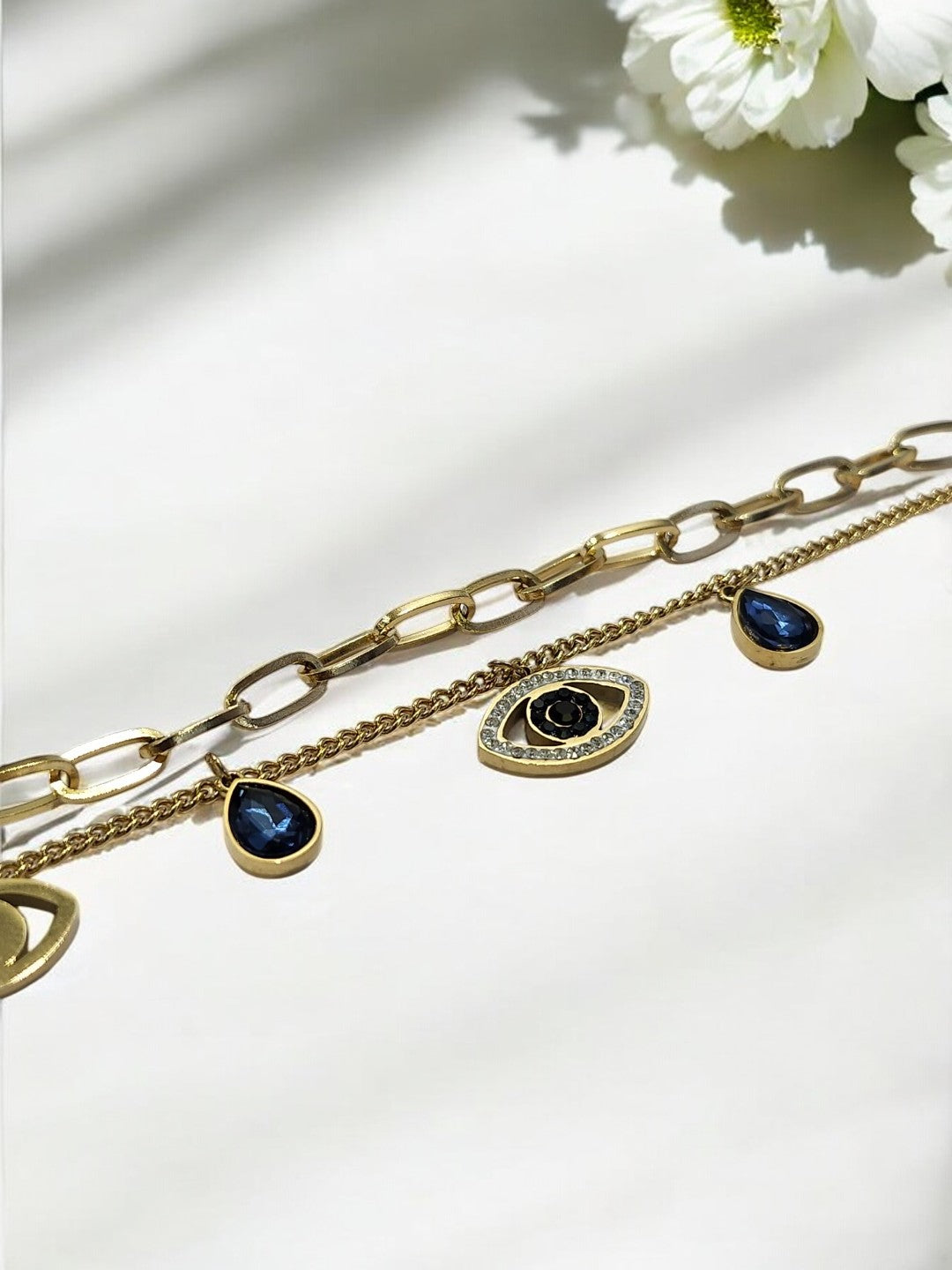 GOLDEN LAYER CHAIN WITH HANGING CHARMS LIKE BLUE DROP DIAMOND EVIL EYE AND TINY SHINY DIAMOND