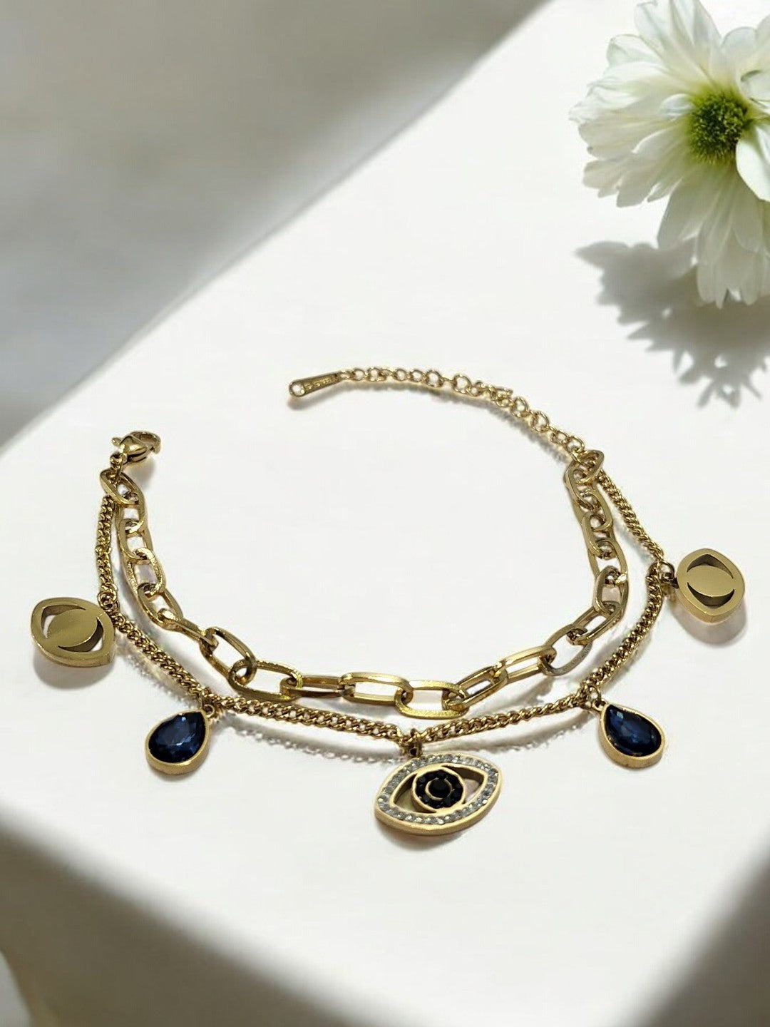 GOLDEN LAYER CHAIN WITH HANGING CHARMS LIKE BLUE DROP DIAMOND EVIL EYE AND TINY SHINY DIAMOND