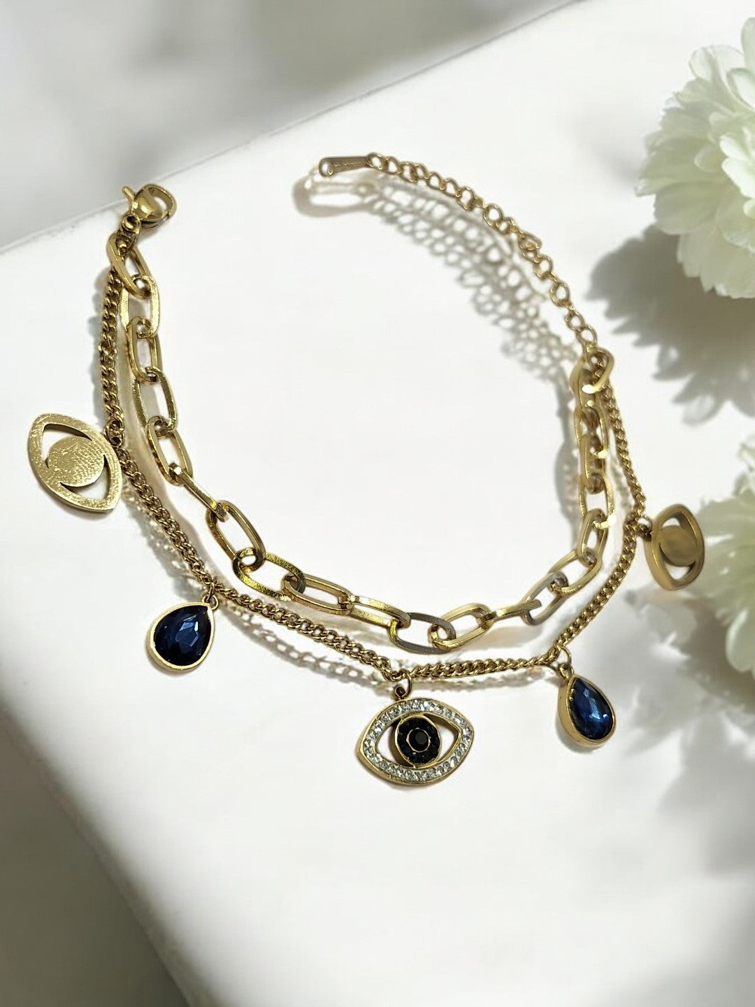 GOLDEN LAYER CHAIN WITH HANGING CHARMS LIKE BLUE DROP DIAMOND EVIL EYE AND TINY SHINY DIAMOND