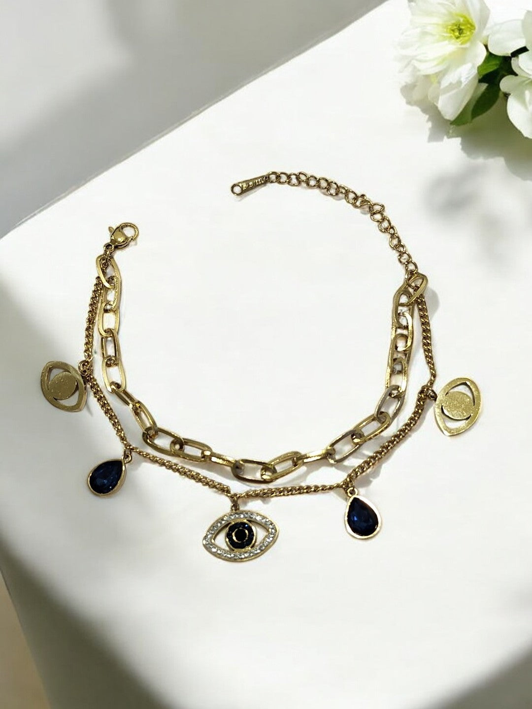 GOLDEN LAYER CHAIN WITH HANGING CHARMS LIKE BLUE DROP DIAMOND EVIL EYE AND TINY SHINY DIAMOND
