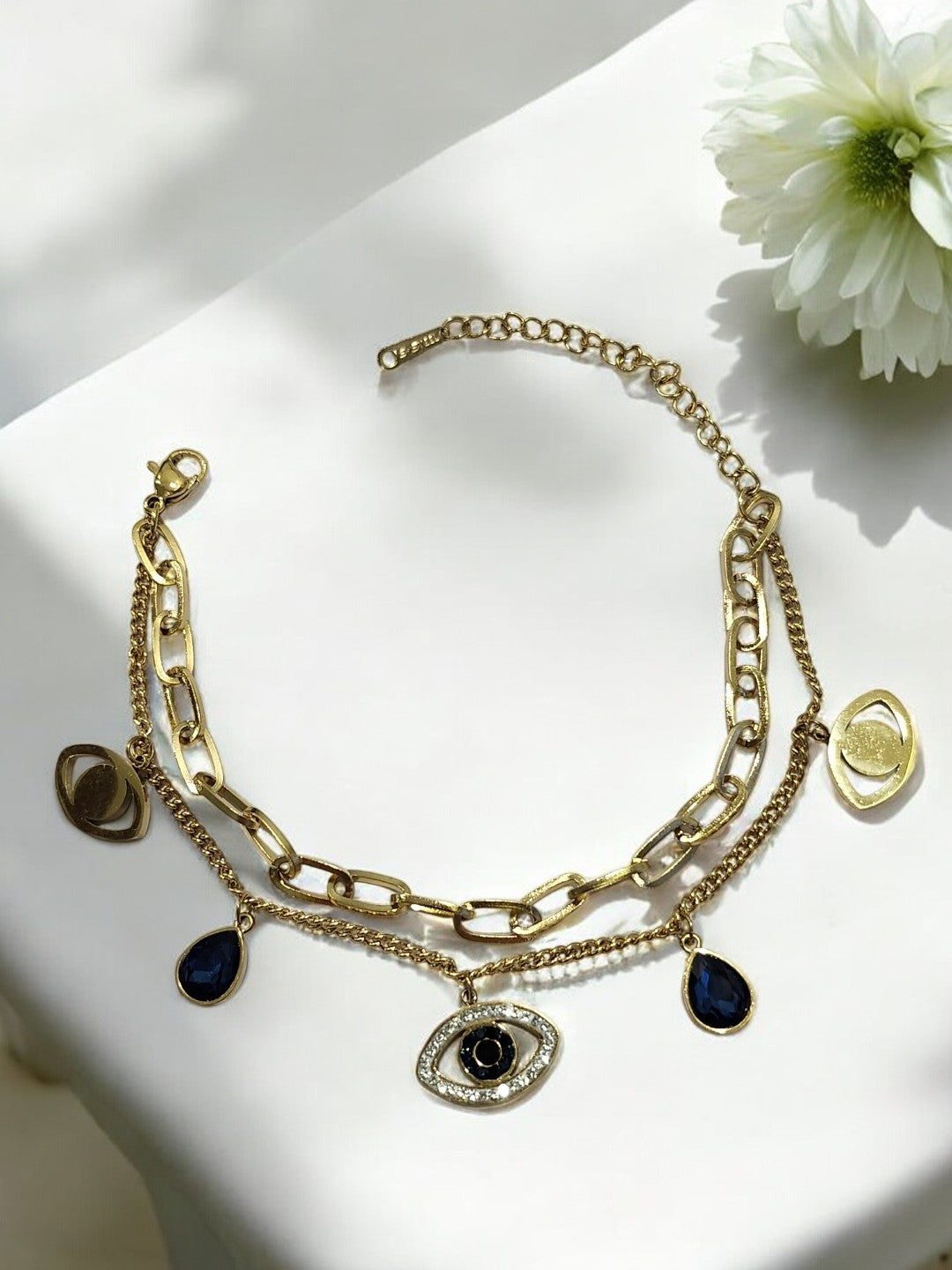 GOLDEN LAYER CHAIN WITH HANGING CHARMS LIKE BLUE DROP DIAMOND EVIL EYE AND TINY SHINY DIAMOND
