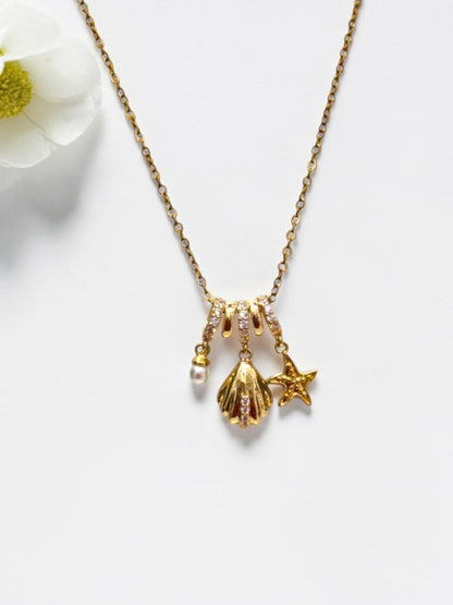 GOLDEN OCEAN CHARMS RIELLA NECKLACE