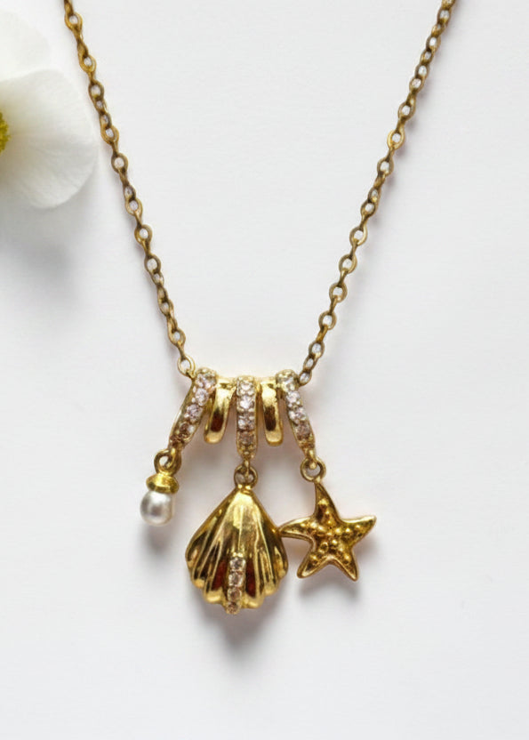 GOLDEN OCEAN CHARMS RIELLA NECKLACE