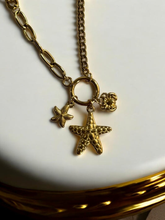 GOLDEN CHAIN WITH BEACH CHARM LIKE STAR FISH AND CRAB 