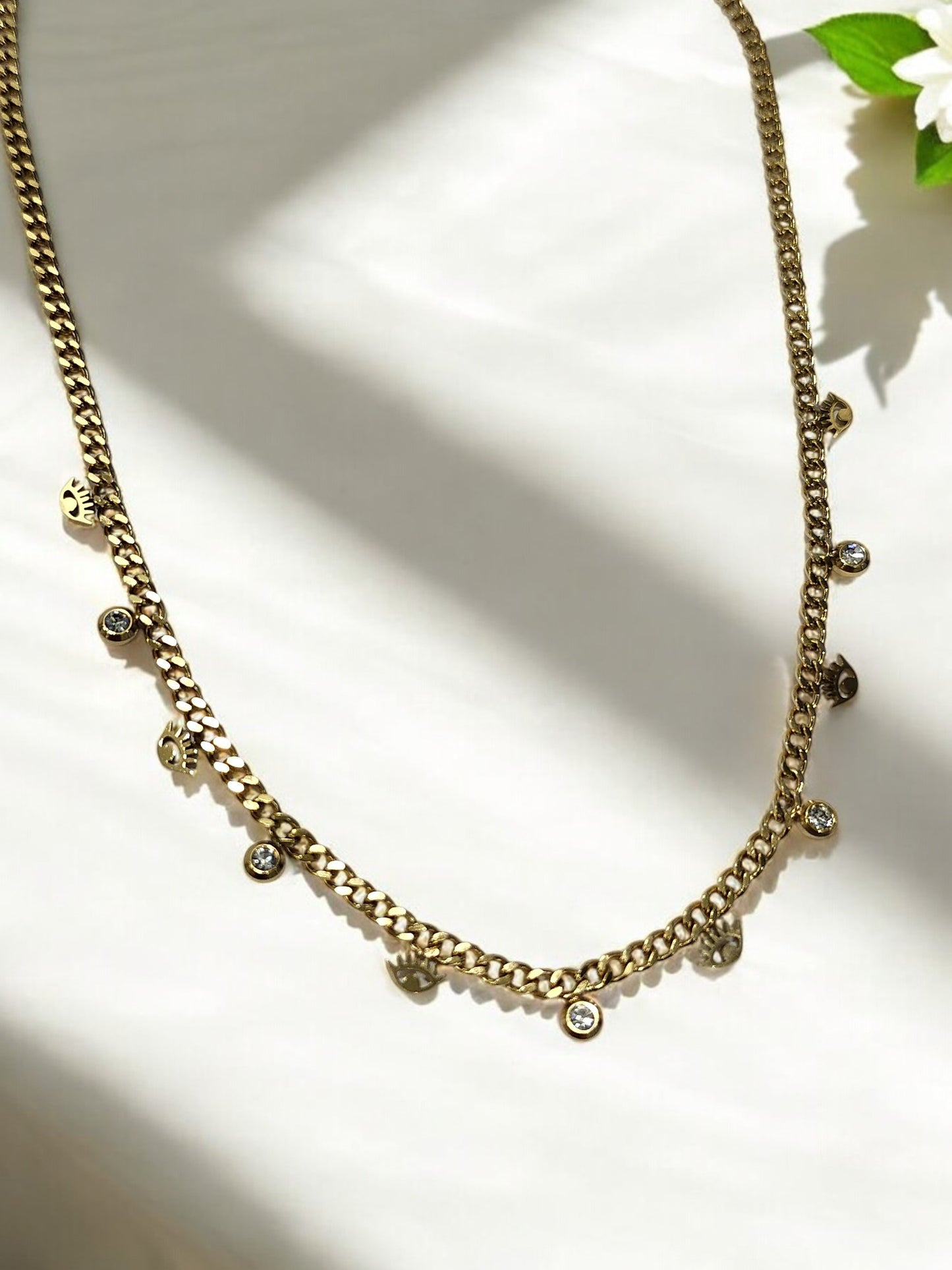 GOLDEN CHAIN WITH SHINY TINY HANGING DIAMOND AND EVIL EYE