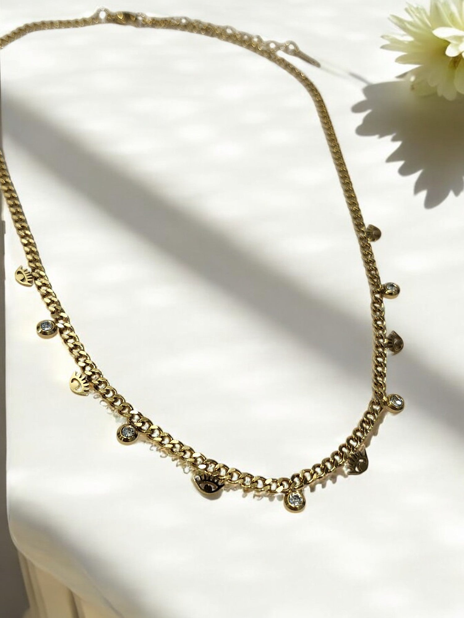 GOLDEN CHAIN WITH SHINY TINY HANGING DIAMOND AND EVIL EYE