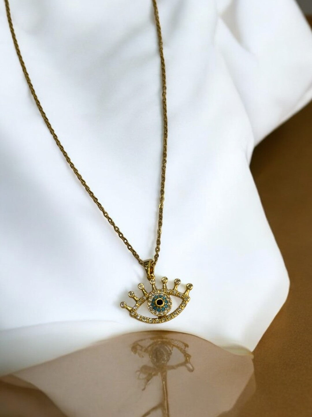 GOLDEN CHAIN WITH ROTATE EVIL EYE PENDENT