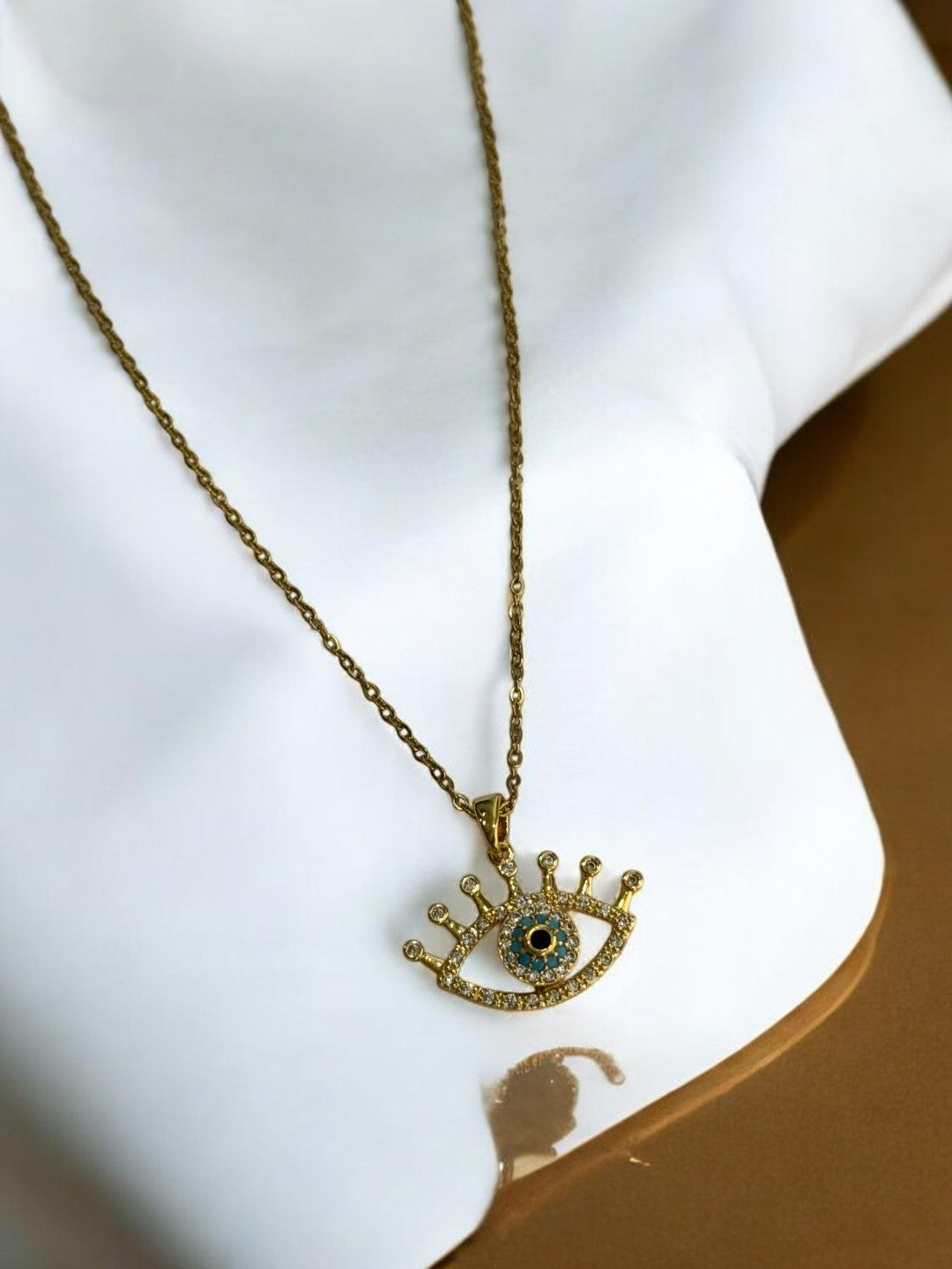 GOLDEN CHAIN WITH ROTATE EVIL EYE PENDENT