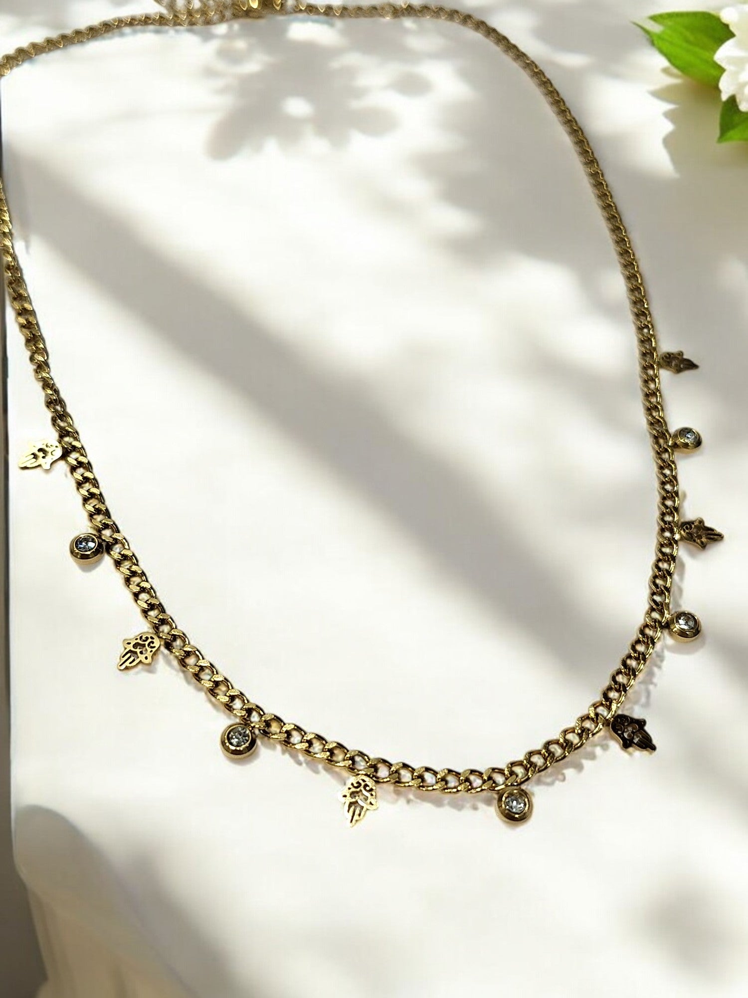 GOLDEN CHAIN WITH HANGING NONVIOLENCE SYMBOL AND HANGING DIAMOND