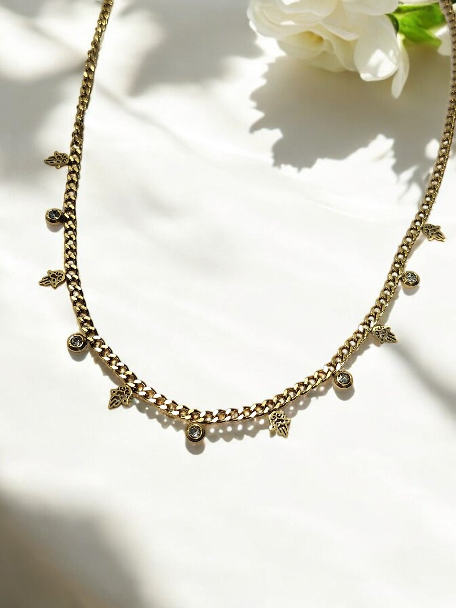 GOLDEN CHAIN WITH HANGING NONVIOLENCE SYMBOL AND HANGING DIAMOND