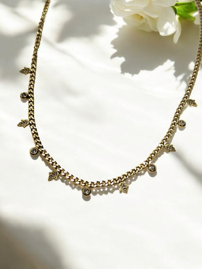 GOLDEN CHAIN WITH HANGING NONVIOLENCE SYMBOL AND HANGING DIAMOND
