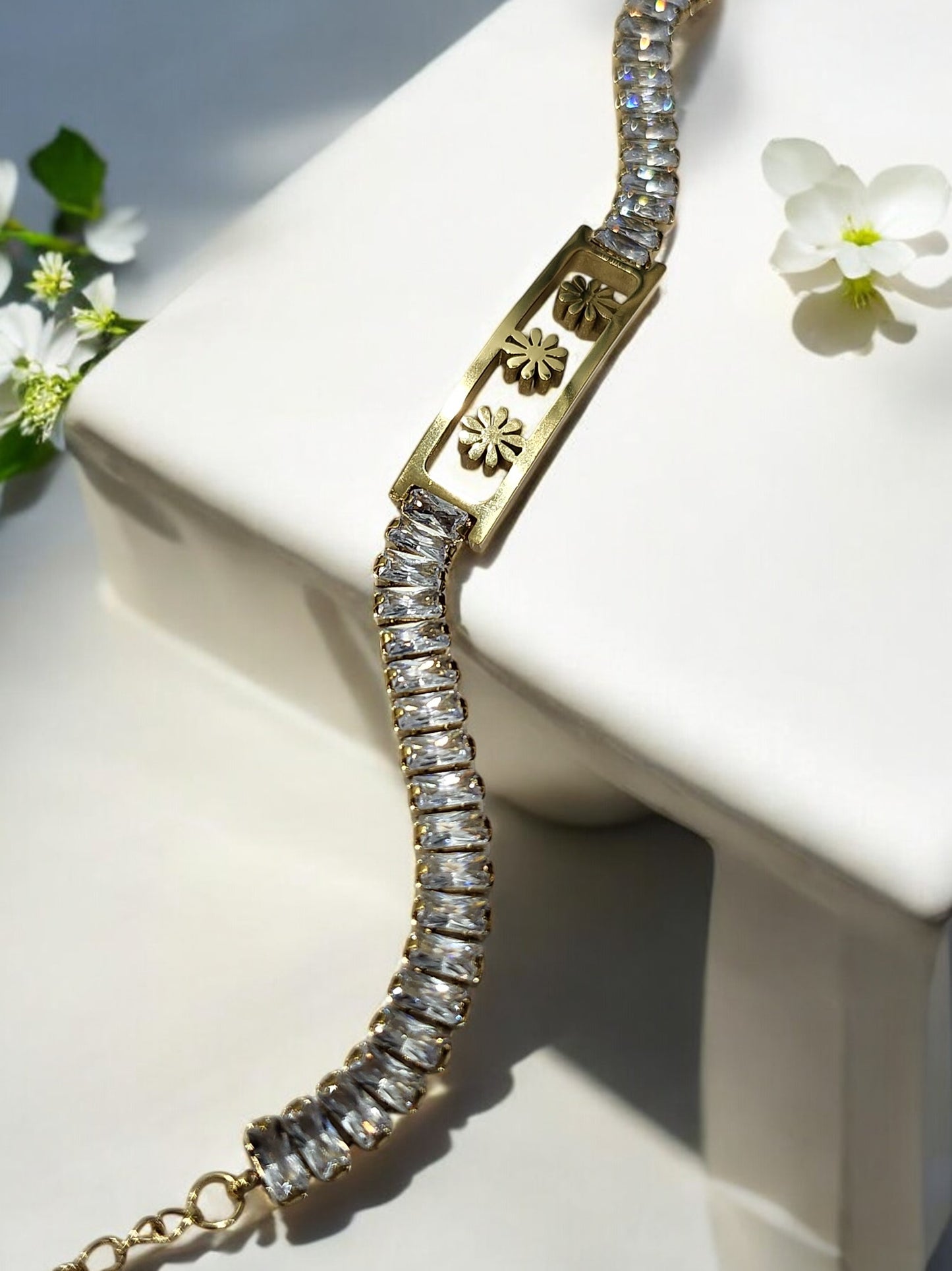 GOLDEN THREE FLOWER WITH RECTANGULAR SHINY DIAMOND