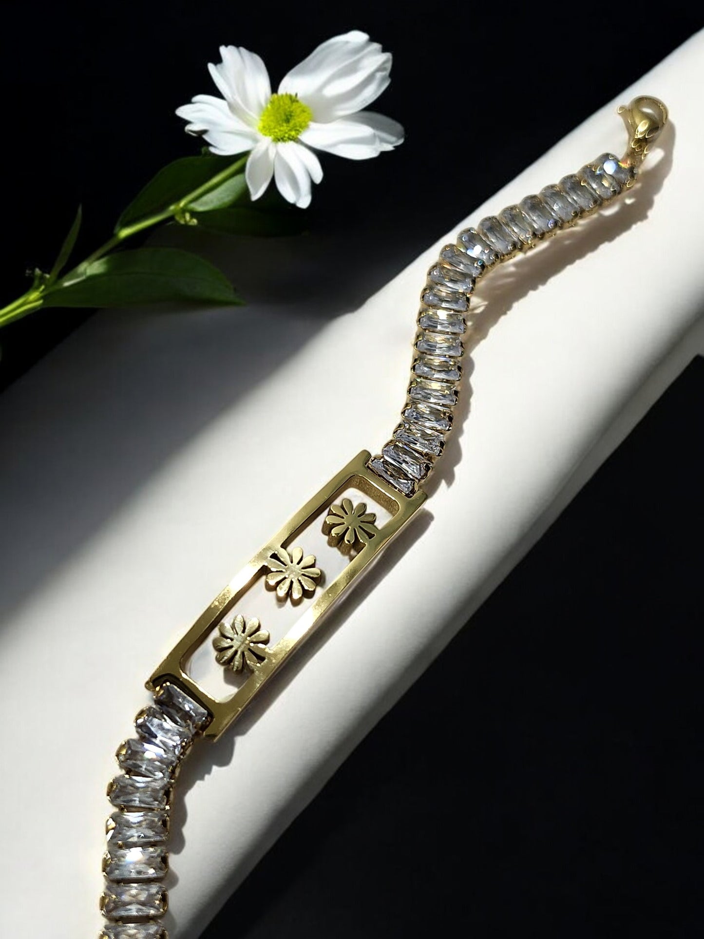 GOLDEN THREE FLOWER WITH RECTANGULAR SHINY DIAMOND