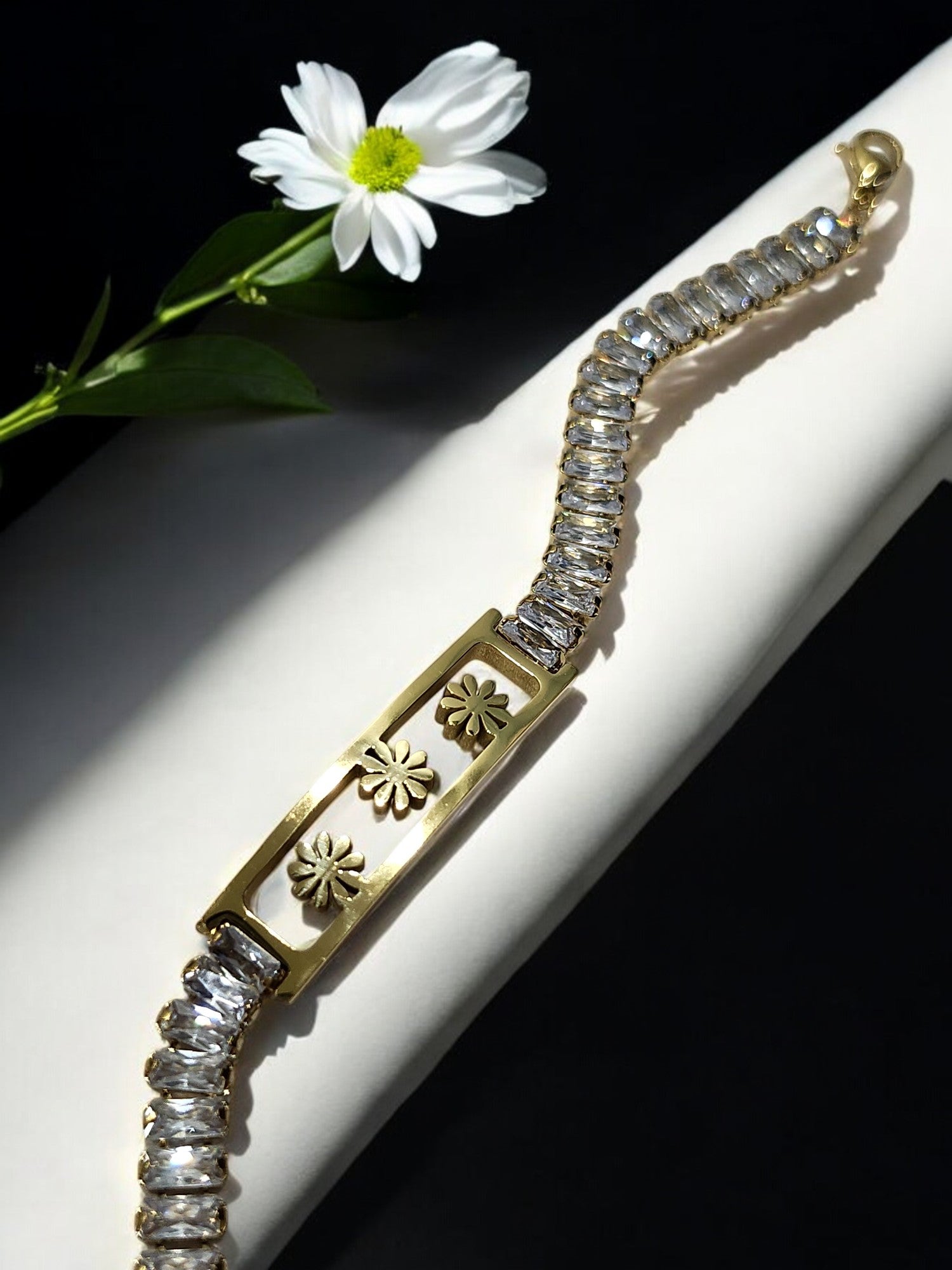 GOLDEN THREE FLOWER WITH RECTANGULAR SHINY DIAMOND