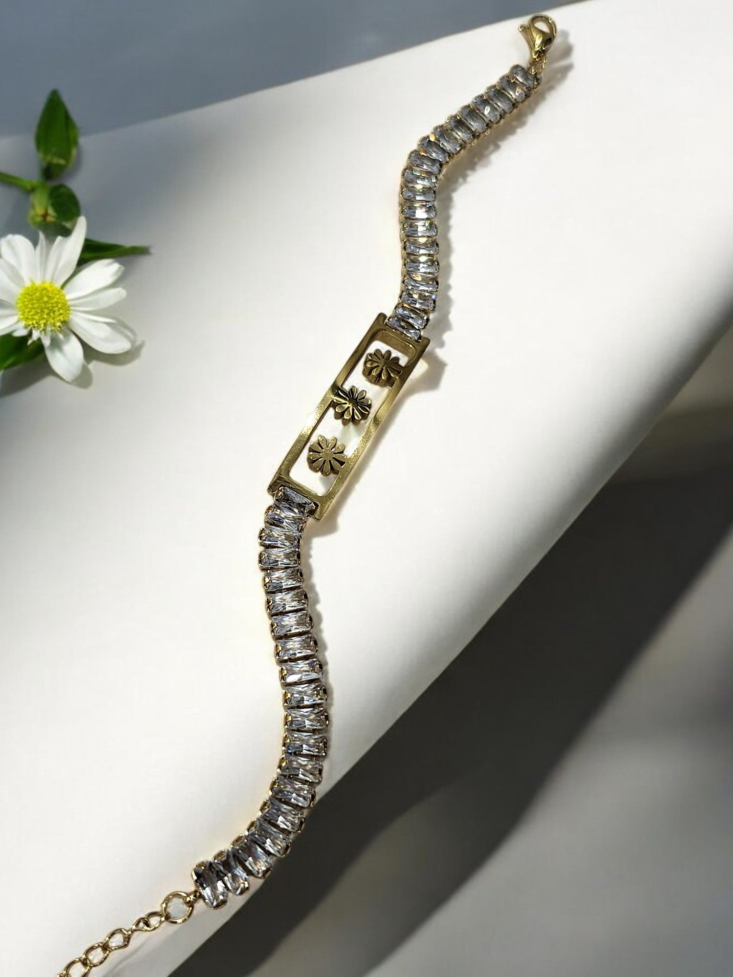 GOLDEN THREE FLOWER WITH RECTANGULAR SHINY DIAMOND