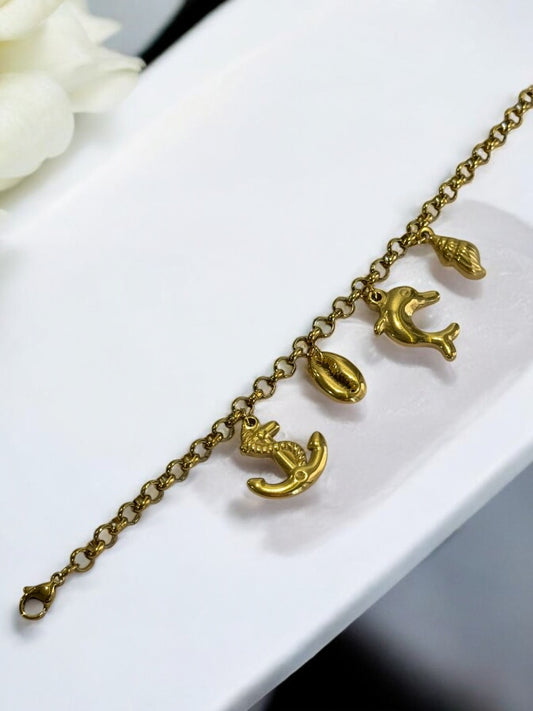 GOLDEN CHAIN BRACELET WITH CHARM LIKE ANCHOR, EYE CONCH AND DOLPHIN