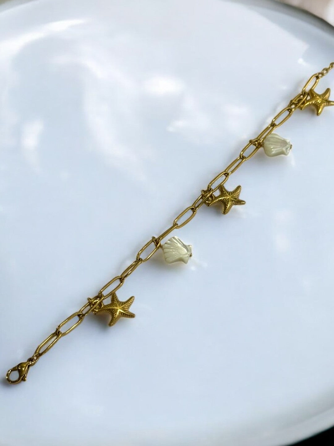 GOLDEN CHAIN BRACELET WITH CHARM LIKE STAR FISH AND SEA SHELL
