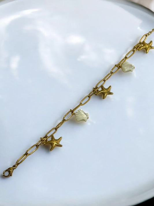 GOLDEN CHAIN BRACELET WITH CHARM LIKE STAR FISH AND SEA SHELL