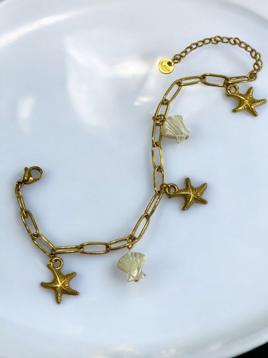 GOLDEN CHAIN BRACELET WITH CHARM LIKE STAR FISH AND SEA SHELL