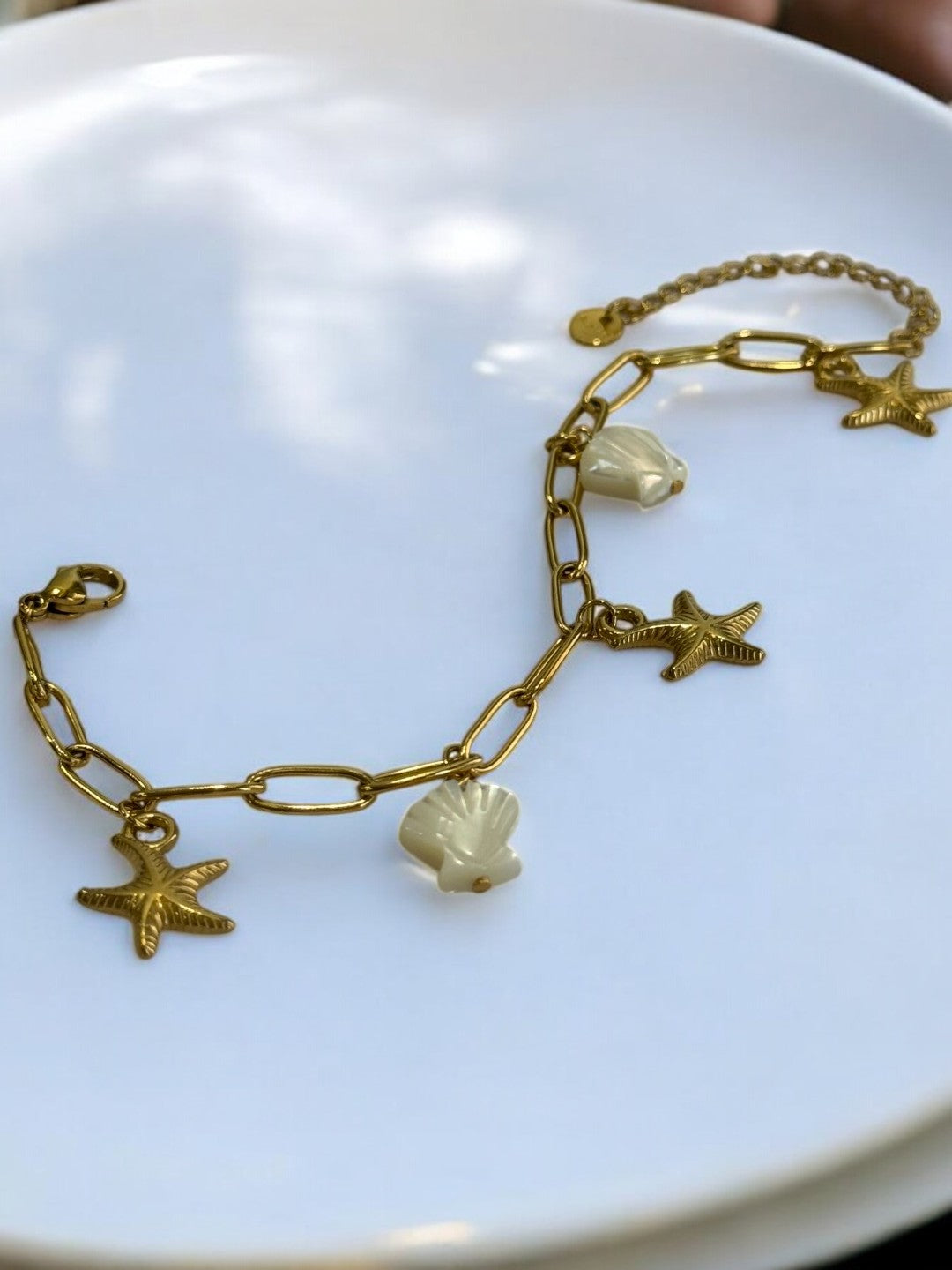 GOLDEN CHAIN BRACELET WITH CHARM LIKE STAR FISH AND SEA SHELL