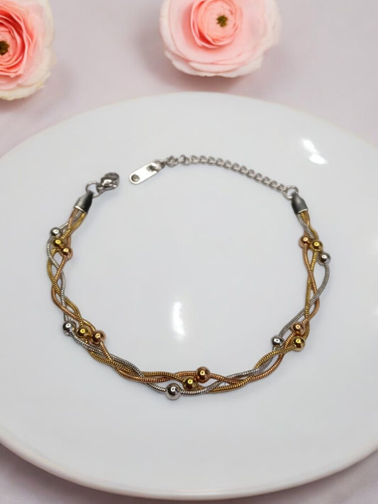GOLD AND SILVER LAYERED WITH TINY BALLS