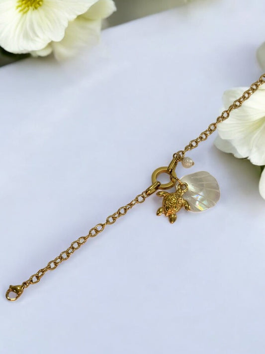 GOLDEN CHAIN WITH CHARMS LIKE TURTLE, SEA SHELL AND PEARL
