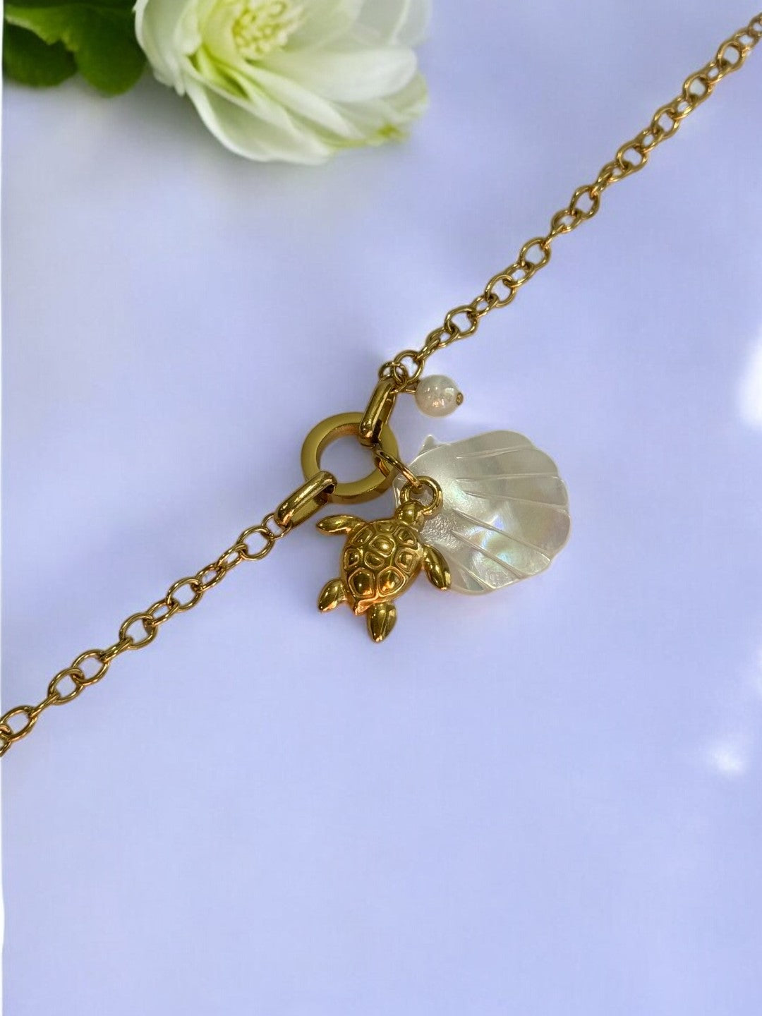 GOLDEN CHAIN WITH CHARMS LIKE TURTLE, SEA SHELL AND PEARL